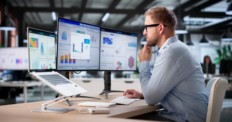 Real-time data analyst monitoring sales metrics for corporate company