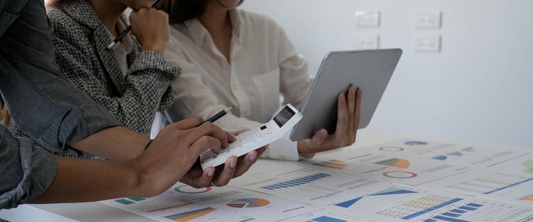 An image of professionals reviewing a digital roadmap or checklist